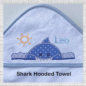 Image of close up of Embroidered Shark blue trim hooded bath towel